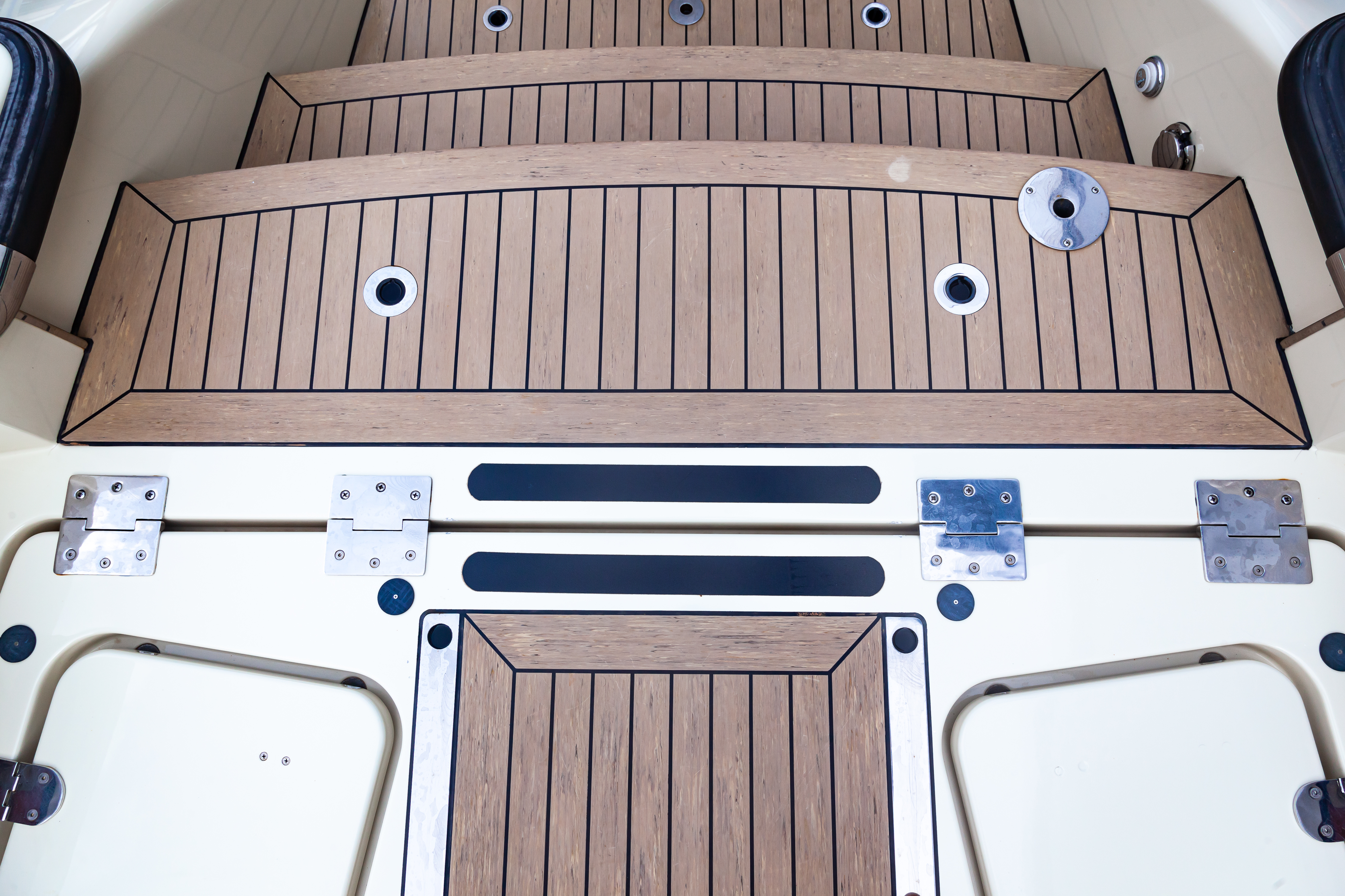 A closeup of hardware on a boat in the water.